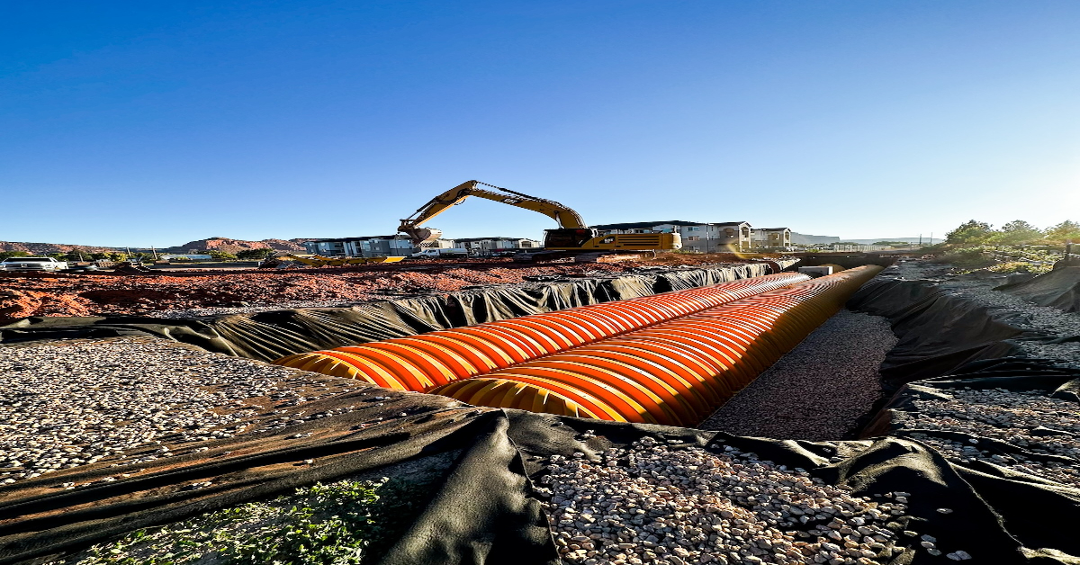 Underground utility installation challenges with excavation equipment and trenching work on site by Prime Excavating in Southern Utah